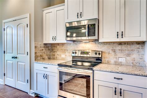 tan cabinets with stainless steel appliances|stainless steel kitchen appliance colors.